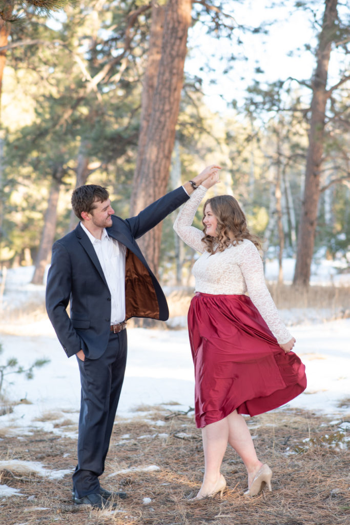 Couple dancing at Alderfer Three Sisters during winter engagement session