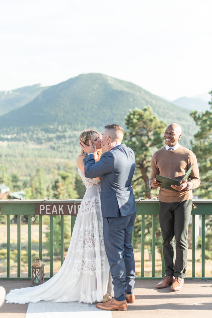Estes Park, Colorado summer elopement ceremony first kiss